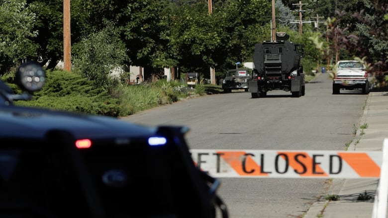 Armored police vehicle navigating closed street
