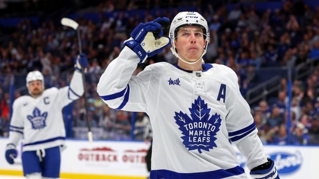 A men's hockey player reacts after scoring a goal.