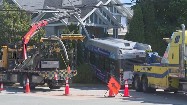 TransLink bus crashes into front yard of Surrey, B.C., home
