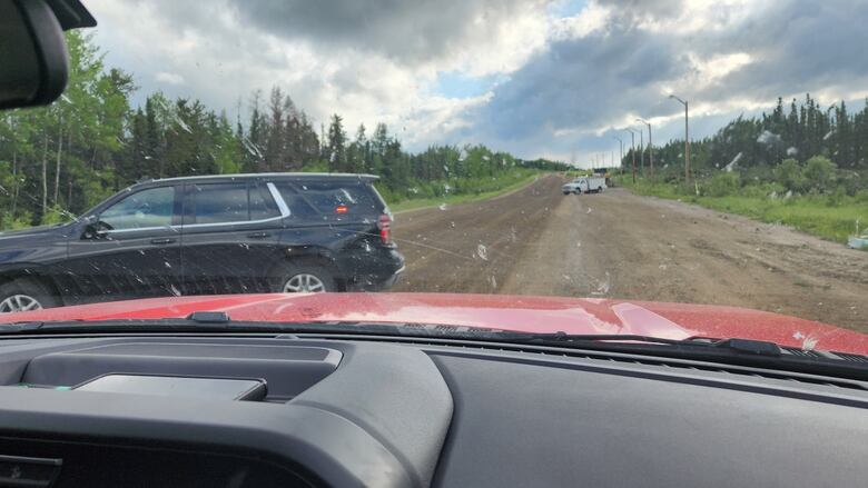 A vehicle's presumption    of the roadworthy  up  of it is seen from the dashboard, with 2  vehicles sitting successful  beforehand   of it.