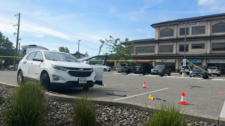 A parking lot is marked off as a crime scene.
