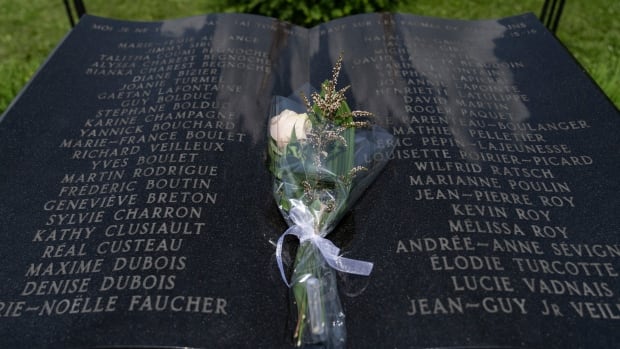 A white rose is seen on a plaque listing the names of 47 victims of the 2013 rail disaster in Lac-Mégantic, Que.