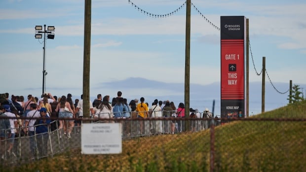 Concert-goers make their way towards the gates at Rogers Stadium in Toronto on Monday, July 7, 2025. Concert-goers make their way towards the gates at Rogers Stadium in Toronto, Monday, July 7, 2025. THE CANADIAN PRESS/Sammy Kogan