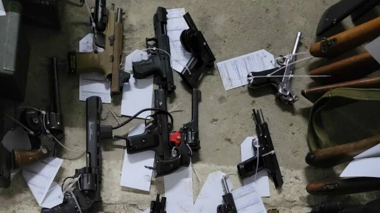 The RCMP said searches conducted in the Québec City area led to the seizure of 16 explosive devices, 83 firearms and accessories, approximately 11,000 rounds of ammunition of various calibres, nearly 130 magazines, four pairs of night vision goggles and military equipment.