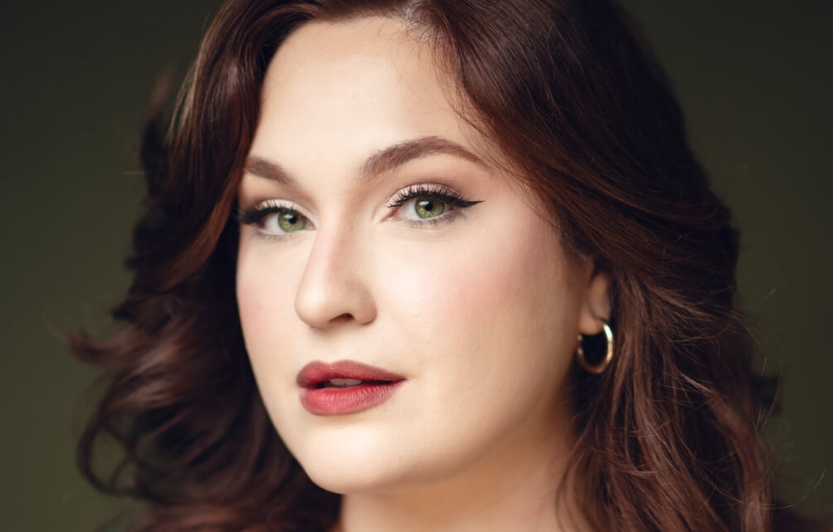 Mezzo-soprano Justine Ledoux looks straight into the camera.