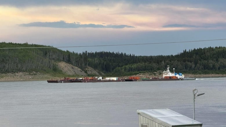 A tow carrying barges down the Mackenzie River near Fort Simpson, N.W.T.