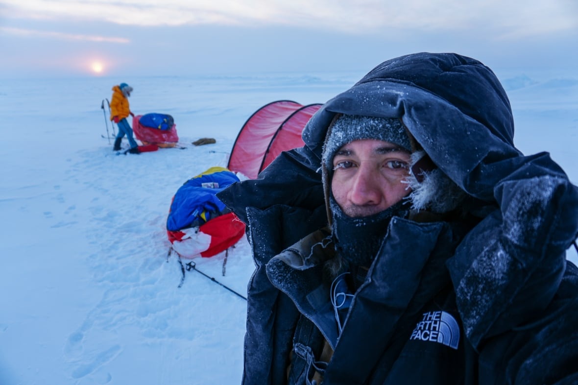 Explorers Felipe Gomez and Eric Larsen on Lake Athabasca.