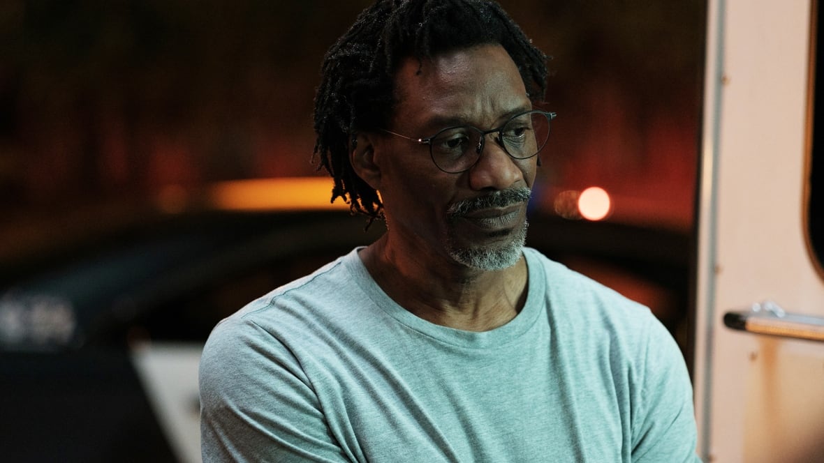 An older black man wearing glasses looked concerned.