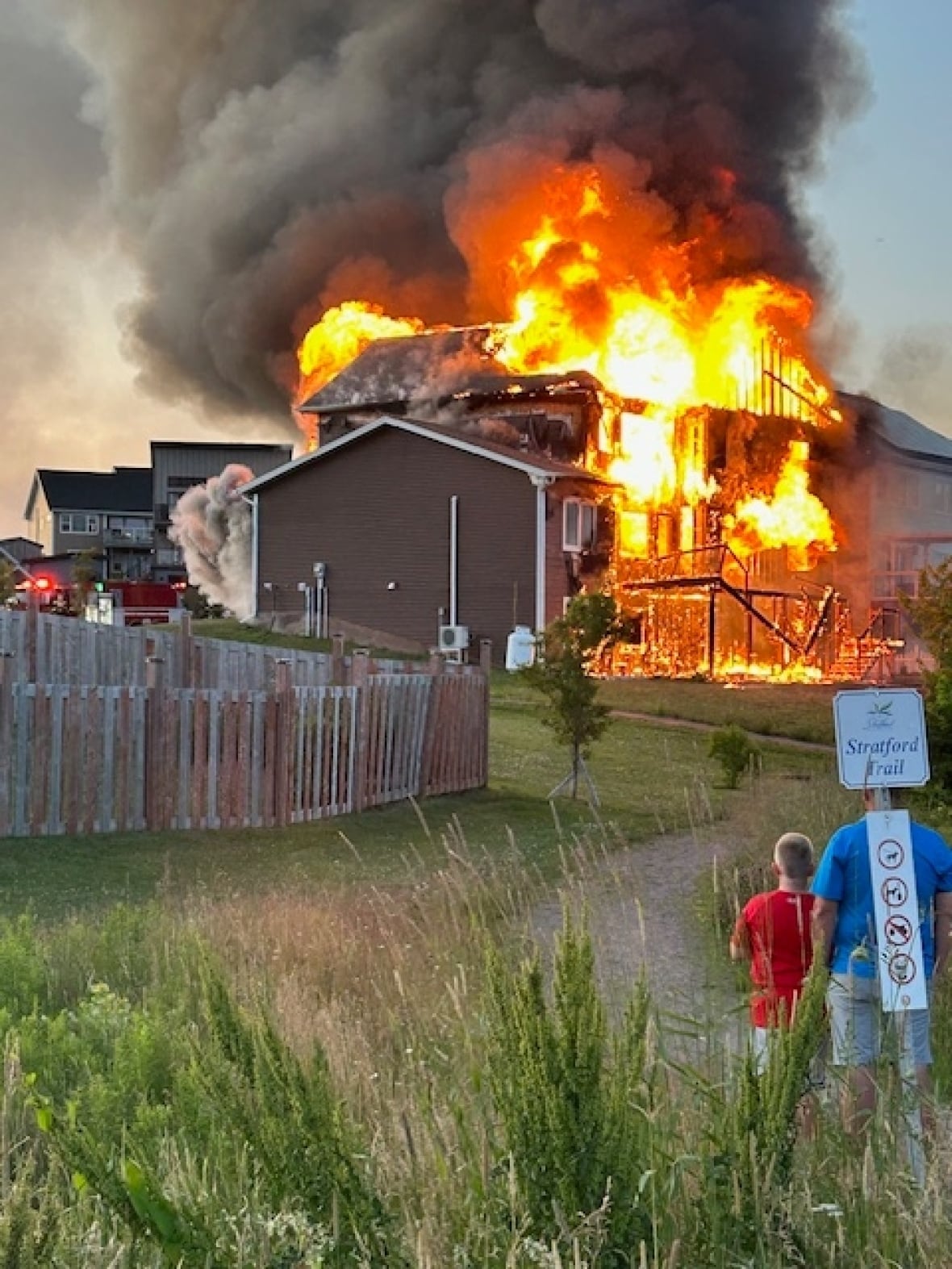 A house on fire on Harvest Drive is seen on Jul 11, 2025
