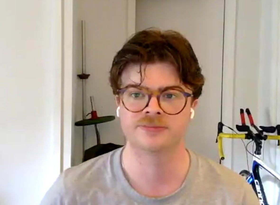 Man looking at camera with a neutral expression.