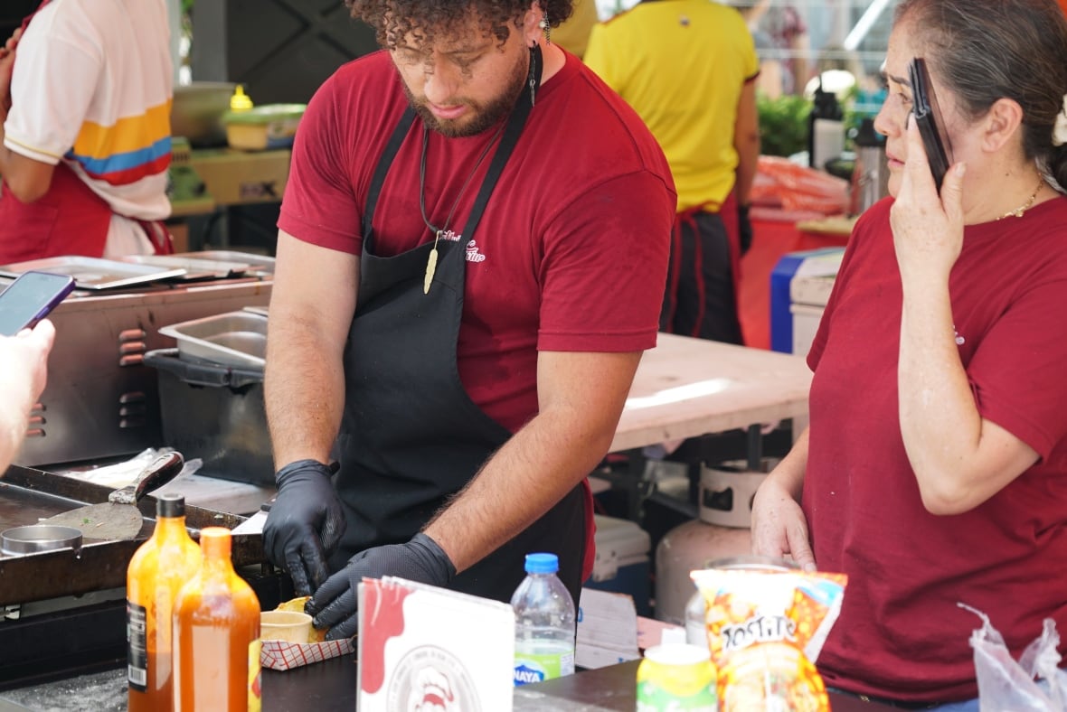 Londoner J.C. Gomez says food has become a common language that brings different cultures together. Originally from Colombia, Gomez was a vendor at a Mexican taco stall and said people from all kinds of backgrounds came to try his food. 