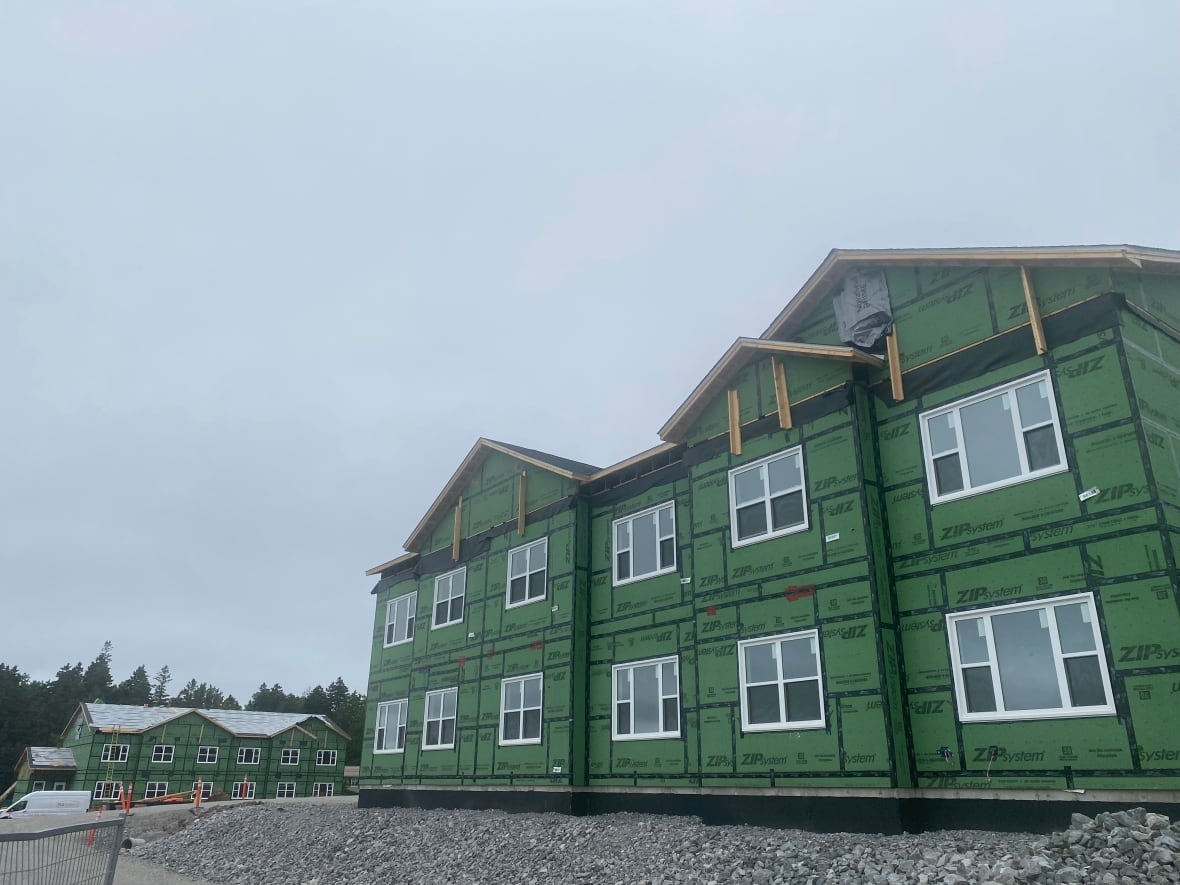 a pair of apartment buildings under construction.