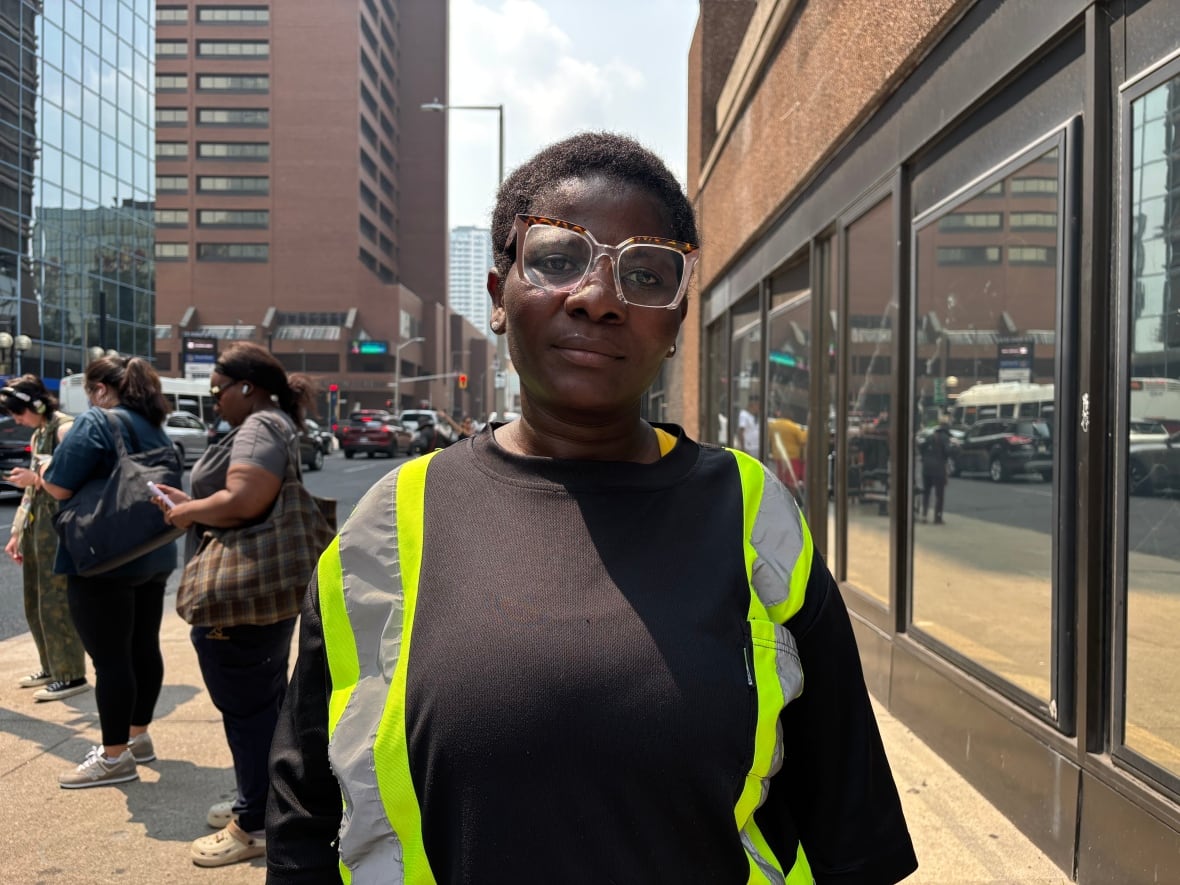 A woman looks at the camera
