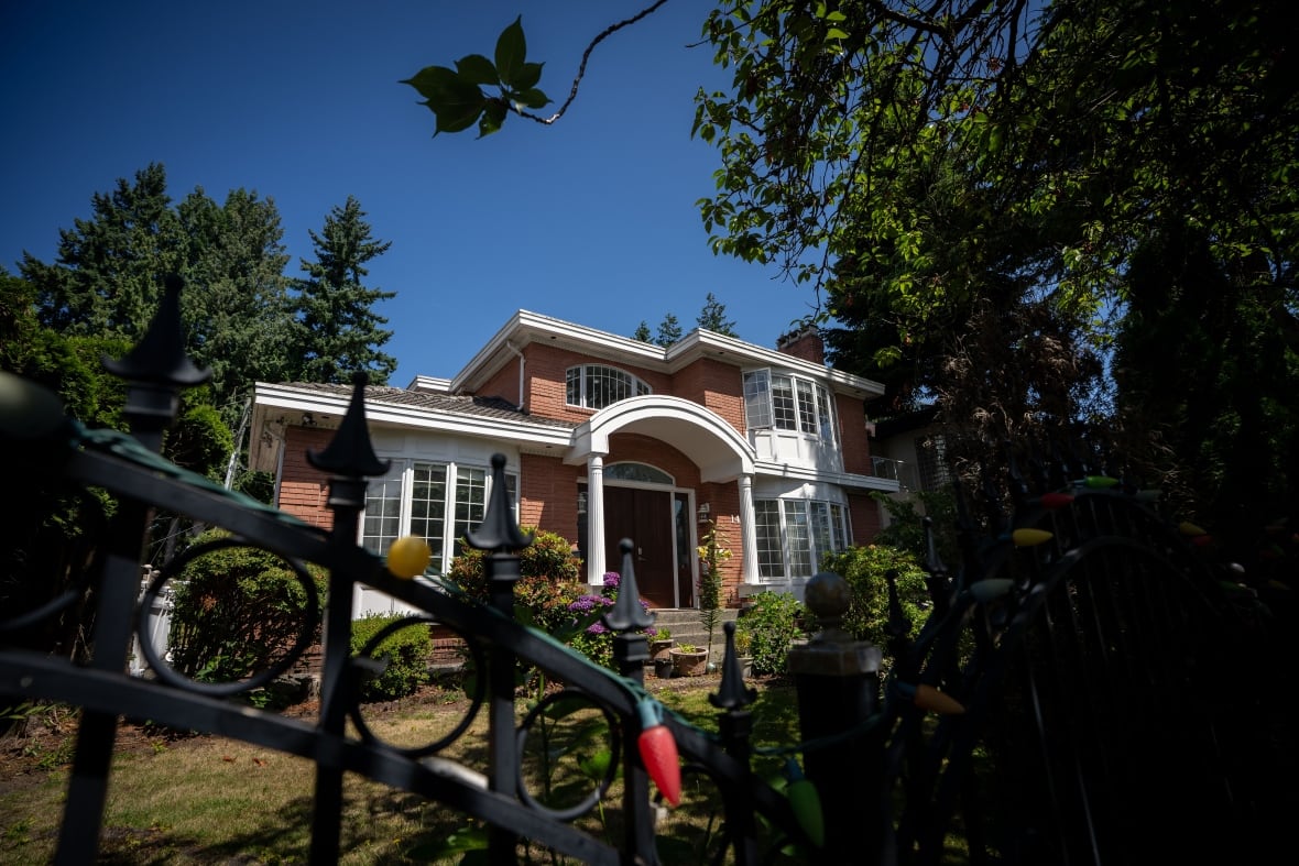 A large brick house with white trim.