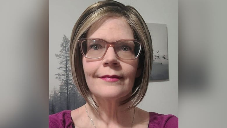 A woman with glasses.