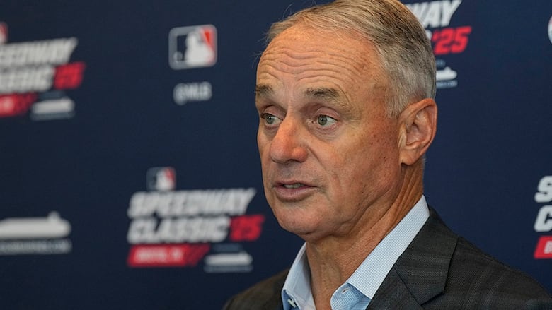 Baseball commissioner Rob Manfred and Major League Baseball Players Association executive director Tony Clark speak before Game 1 of the World Series between the Houston Astros and Atlanta Braves on October 26, 2021 in Texas. 