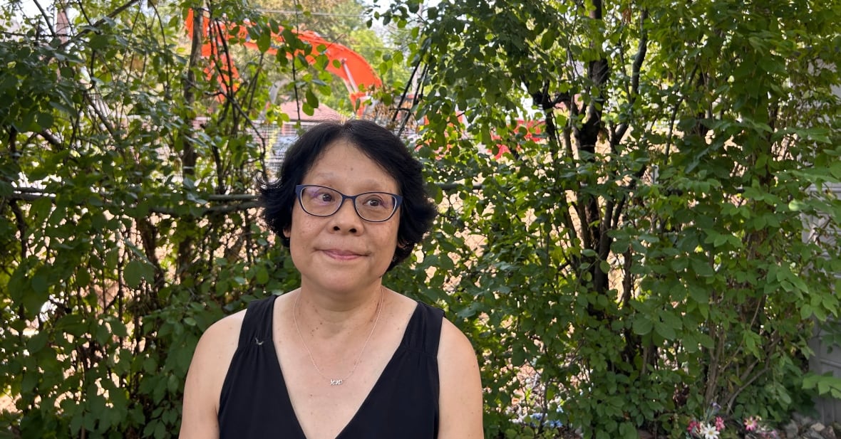 Karin Hwang, who lives next door to the property, says watching the tree come down brought her to tears, after living beside it for 35 years.