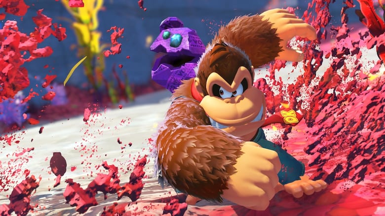 video game screenshot of donkey kong smashing red rocks