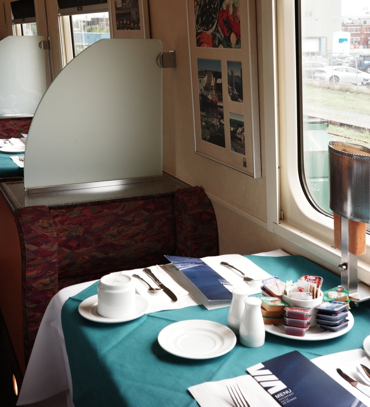 table with plates and utensils on a train