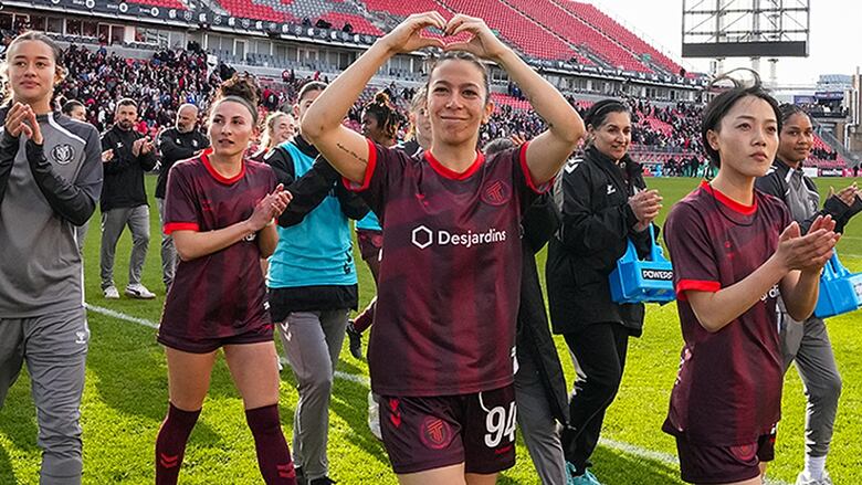 AFC Toronto midfielder Victoria Pickett and midfielder Aoi Kizaki greet fans after Northern Super League soccer action against Montreal Roses FC in Toronto on April 19, 2025.