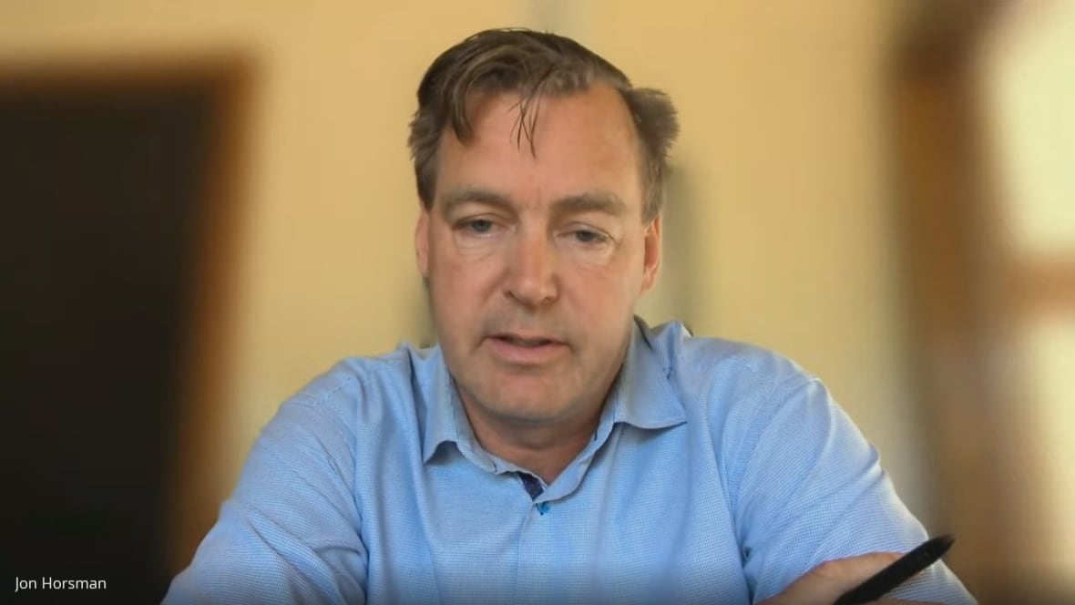 Man speaking in front of blurred background