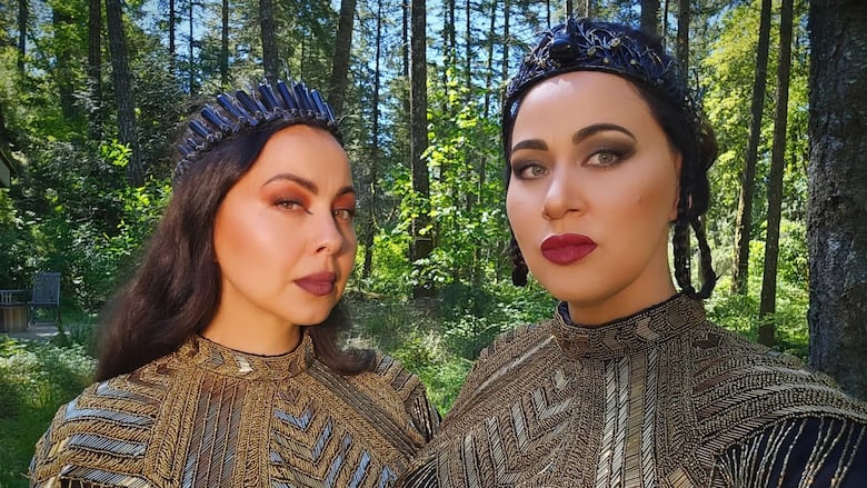 Two women posing for a photo outside.