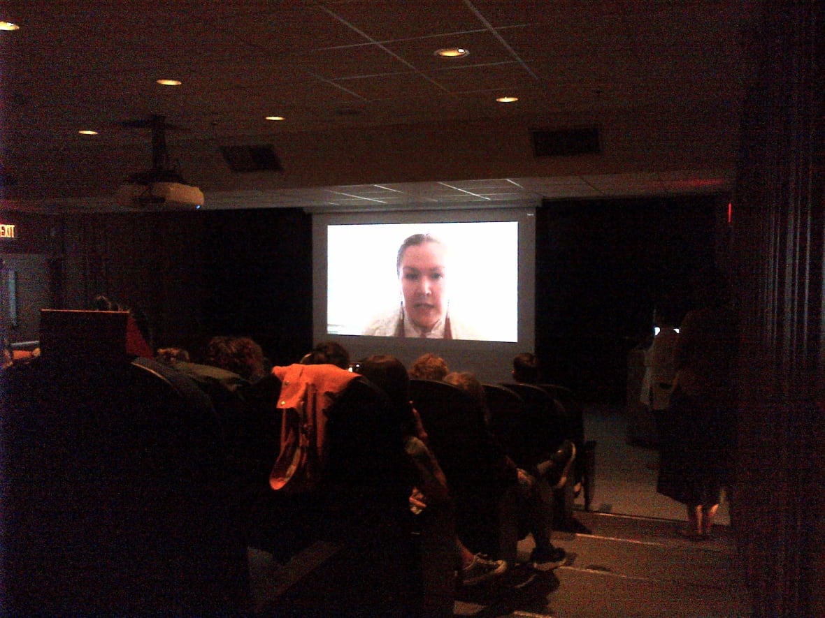 A movie screen in a dark room