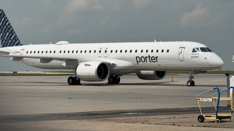 A small white plane with 'Porter' written on the side sits on a tarmac.