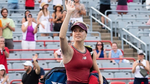 Canadian women’s tennis player Eugenie Bouchard waves to the crowd following her qualifying match loss to American Danielle Collins at the National Bank Open tournament in Montreal on August 5, 2023.