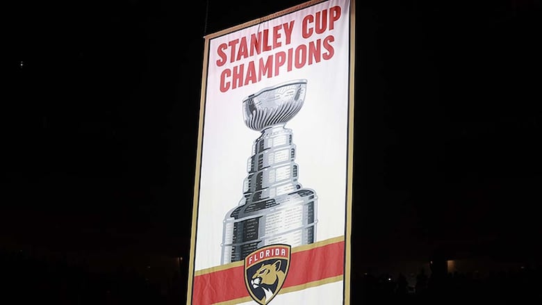 The 2024 Stanley Cup championship banner is raised over the ice during a ceremony before the Florida Panthers' home opener against the Boston Bruins at Amerant Bank Arena on October 8, 2024 in Sunrise.
