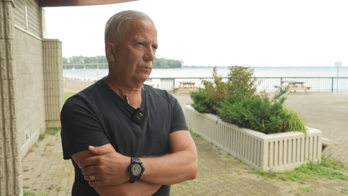 Councillor Angelo Marignani stands at Sandpoint Beach. 