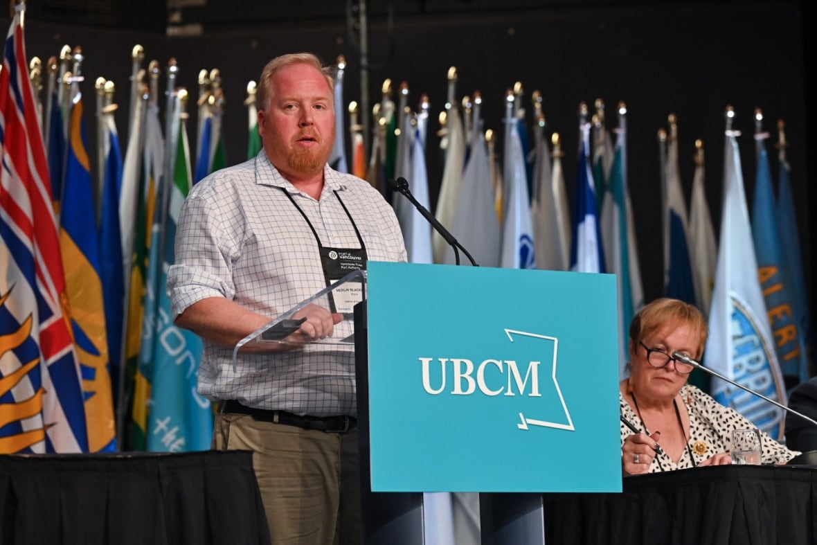 Merlin Blackwell, mayor of Clearwater, stands at a podium reading "UBCM"