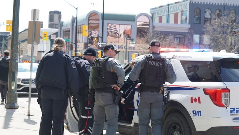 London police officers at the scene of a disturbance in London on Clarence Street, between King and Dundas streets, Apr. 7, 2025.