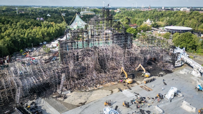 A photo from an aerial view shows damaged steel and iron of a concert stage.