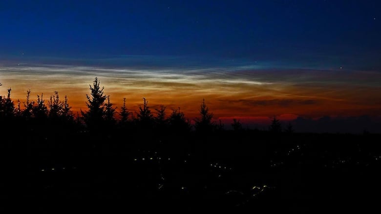 Glowy clouds in a dark night sky
