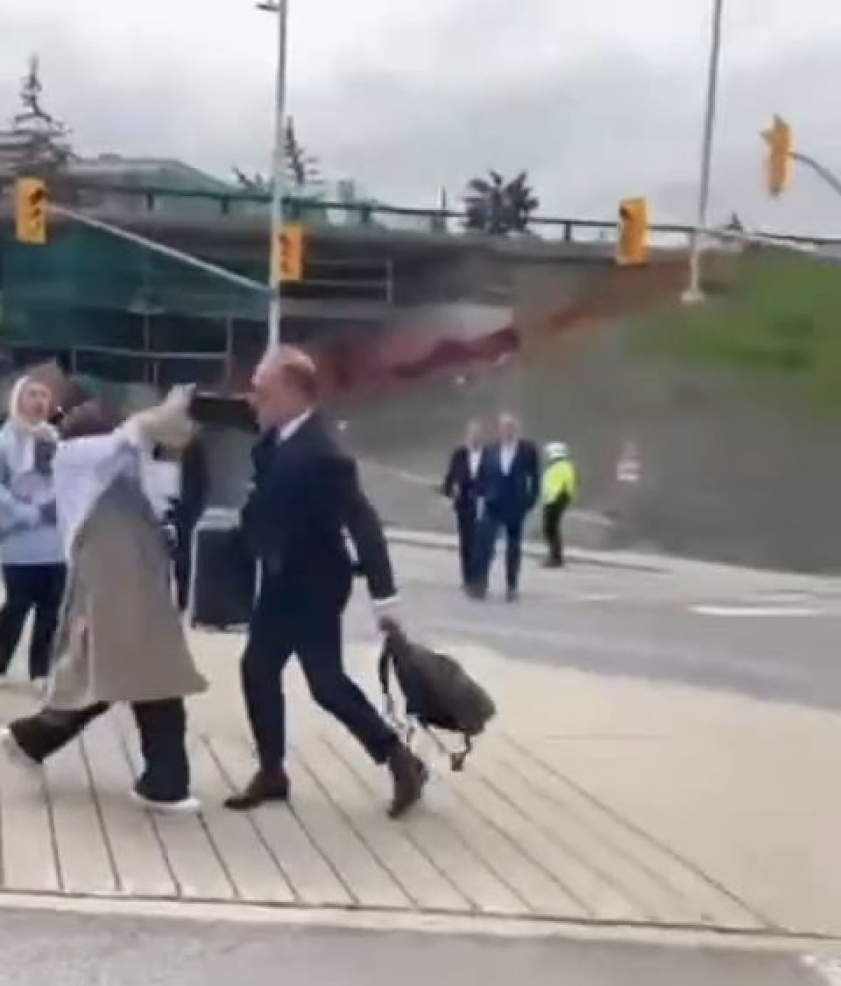 David Henschel striking 21-year-old woman wearing a hijab