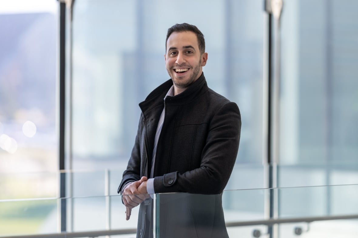 Man standing and smiling