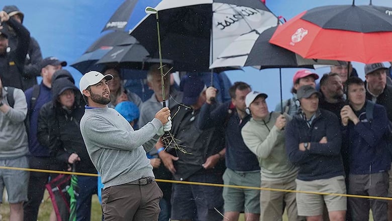 Scottie Scheffler of the United States plays his second shot on the first hole during the first round of the British Open golf championship at the Royal Portrush Golf Club in Northern Ireland on July 17, 2025.