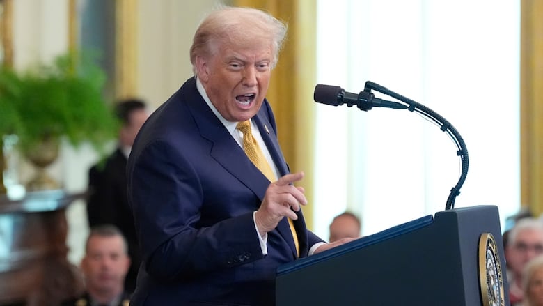 U.S. President Donald Trump speaking in the East Room of the White House.
