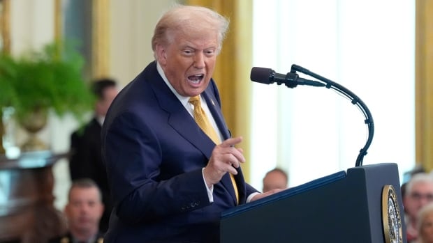 U.S. President Donald Trump speaking in the East Room of the White House.
