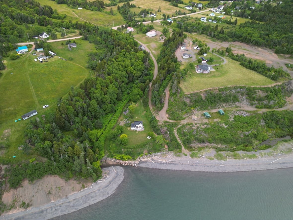 An aerial view of homes near a beach.