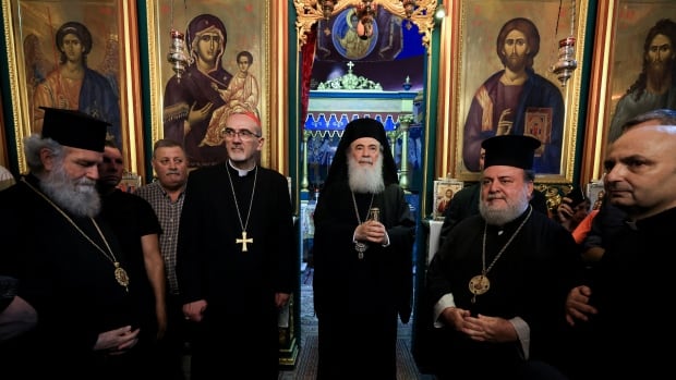 Church leaders stand inside a Gaza church.