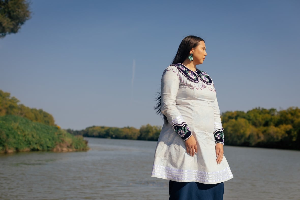 Photo of a woman in front of a river
