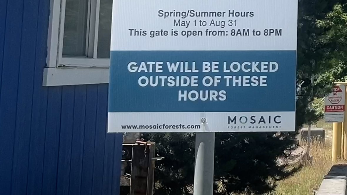 Signage saying, 'Gates will be locked outside of these hours.'