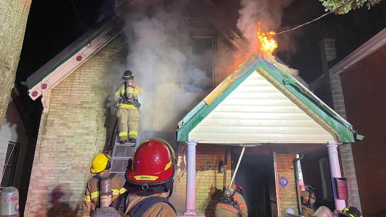 Fire crews battle an early morning fire at 925 Dufferin Ave. in London's Old East Village. Police say the fire has since been deemed suspicious in nature.