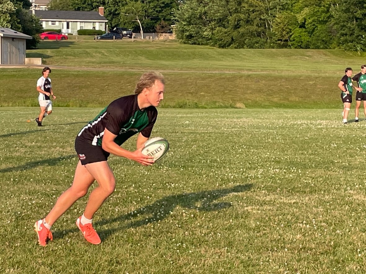 Rugby player holding ball