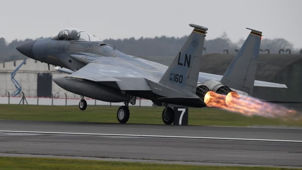 F-15C Eagle U.S. fighter jet takes off from a runway