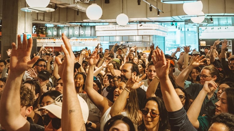 People at a party in a food court.