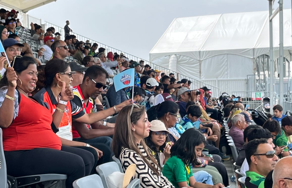 Cricket fans take in a match between the Mississauga Panthers and Toronto Nationals at the Global T20 tournament in Brampton on July 26, 2023.