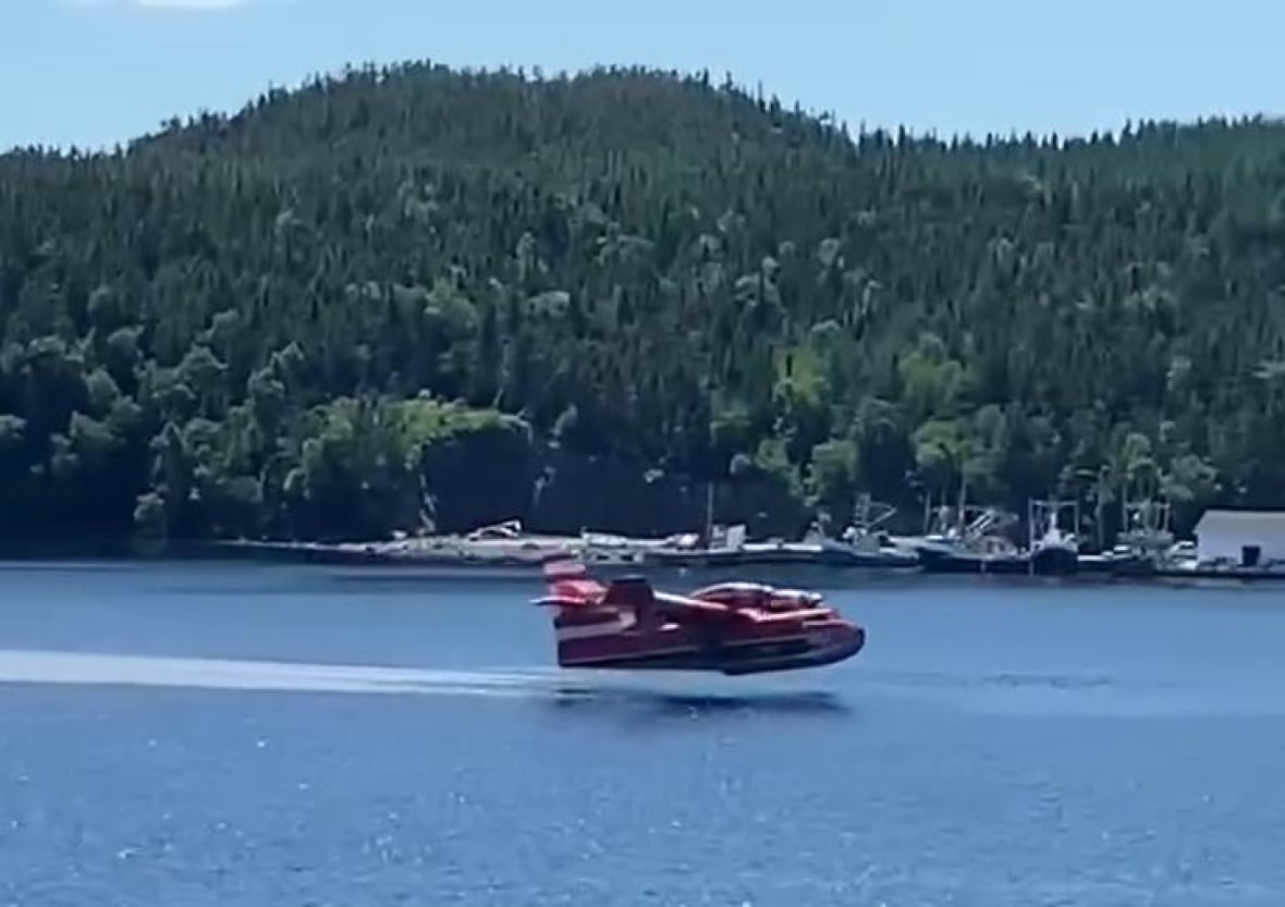 Water bomber close to pond water 